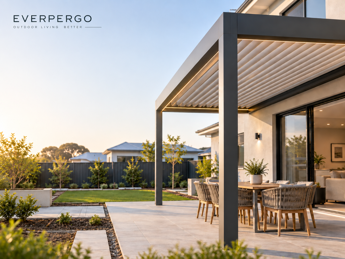 Modern aluminium pergola beside a new-build home with a paved patio and landscaped backyard