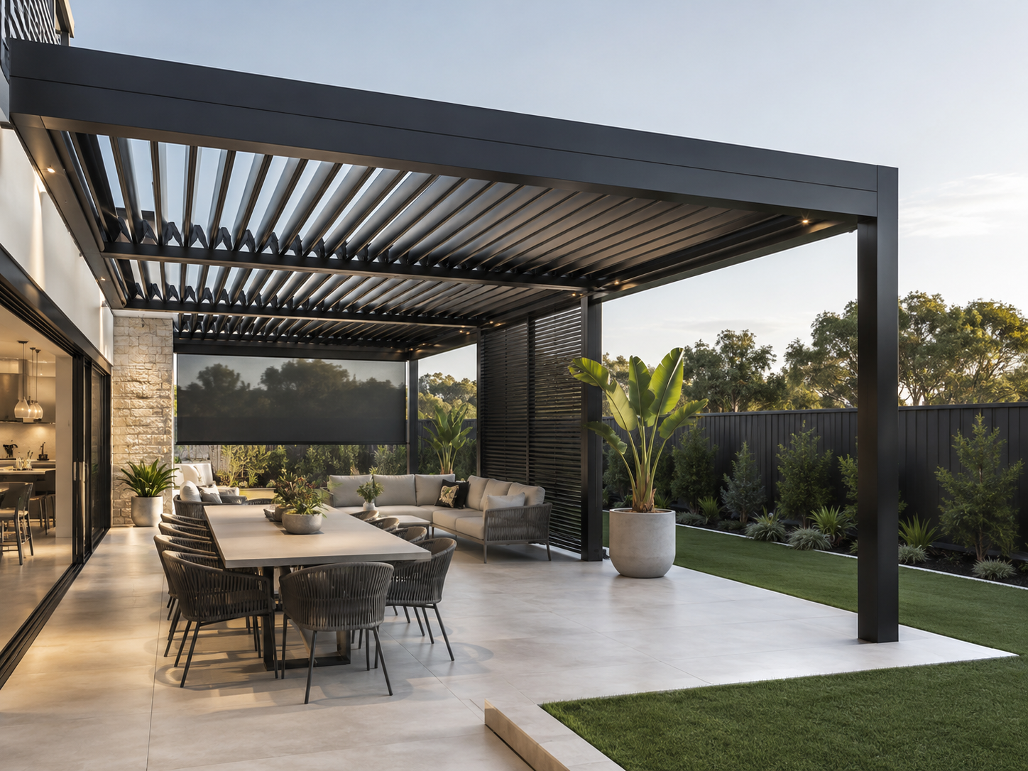 covered patio with aluminium louvered pergola, outdoor dining and lounge area at an Australian home
